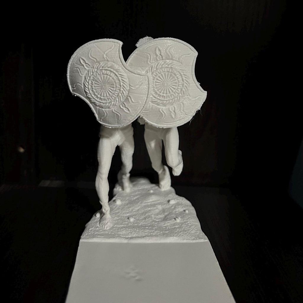 Spartan helmet bookends — pair on shelf