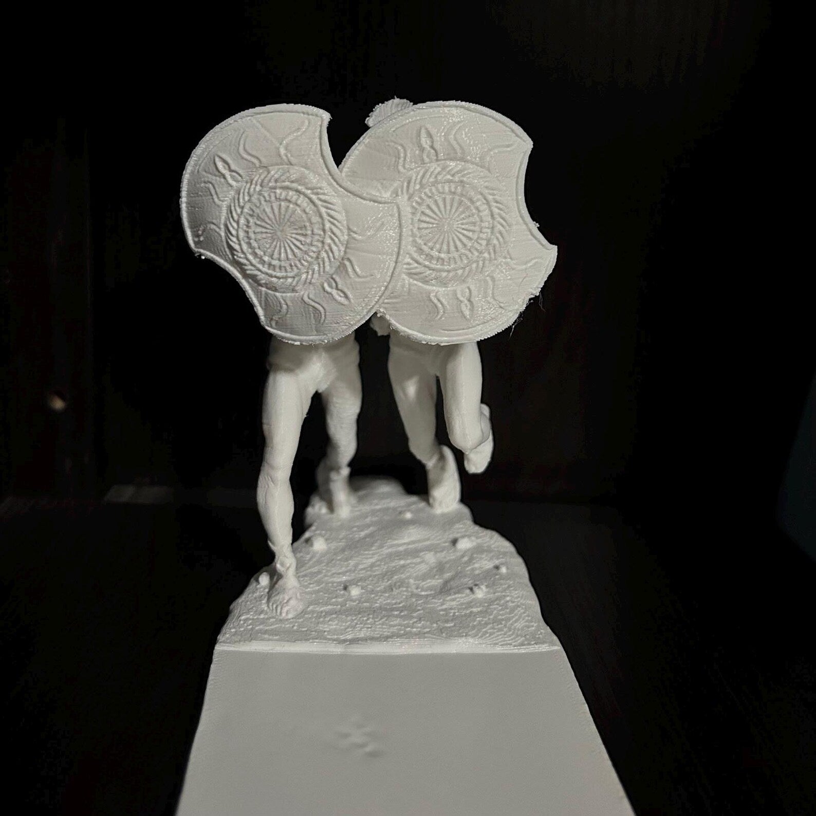 Spartan helmet bookends — pair on shelf