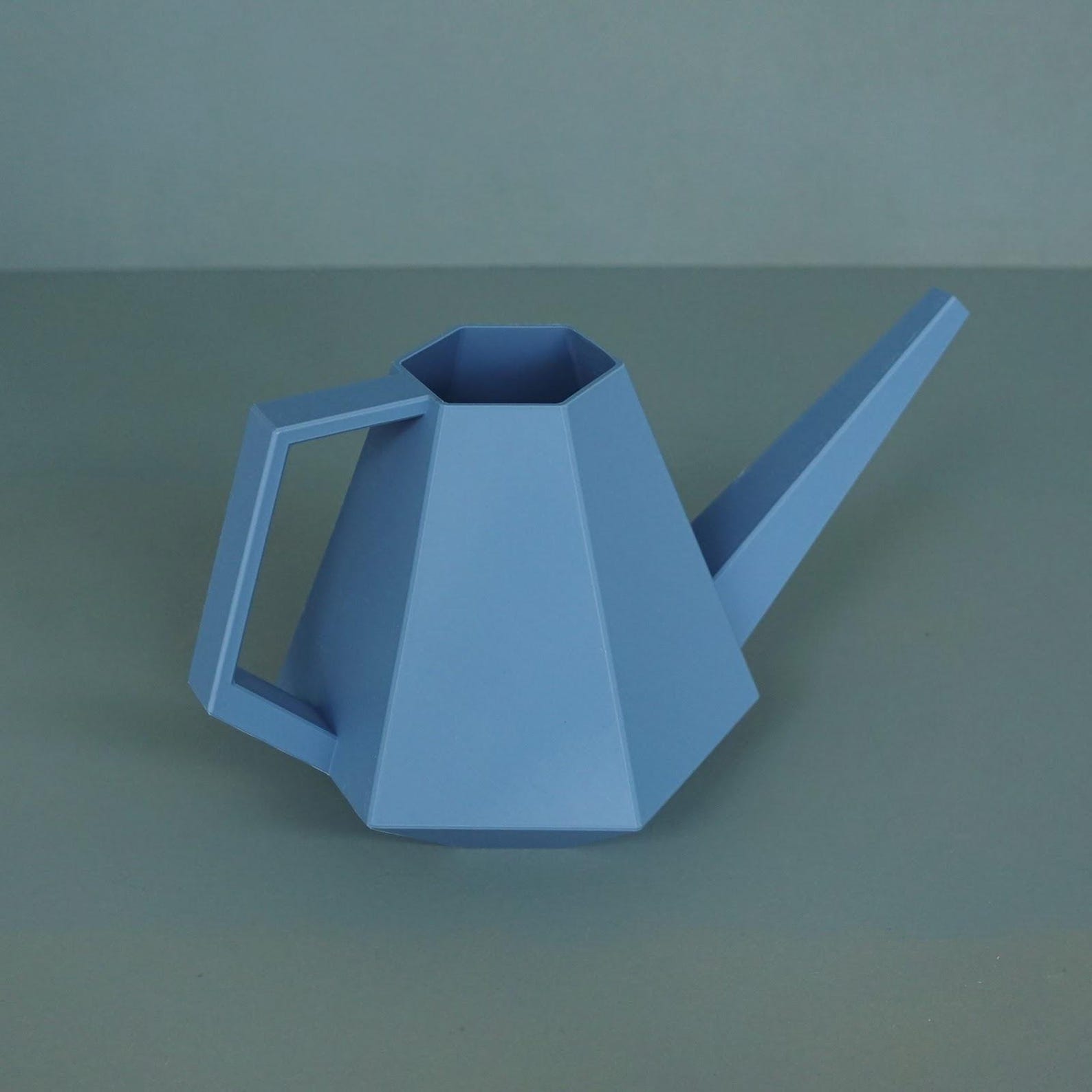 Watering can — in use with plants