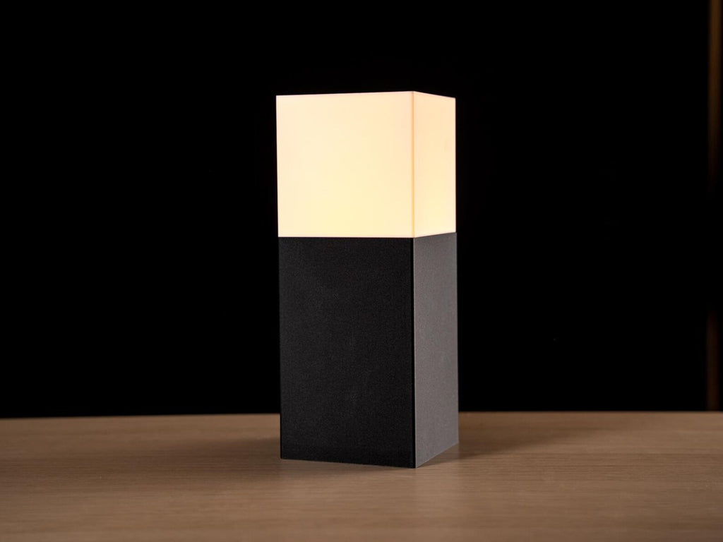 Stele 3D printed modular architectural table lamp on a minimalist desk