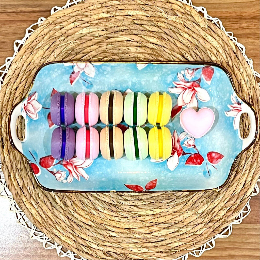 Colorful macaron clicker sensory fidget toys on a tray