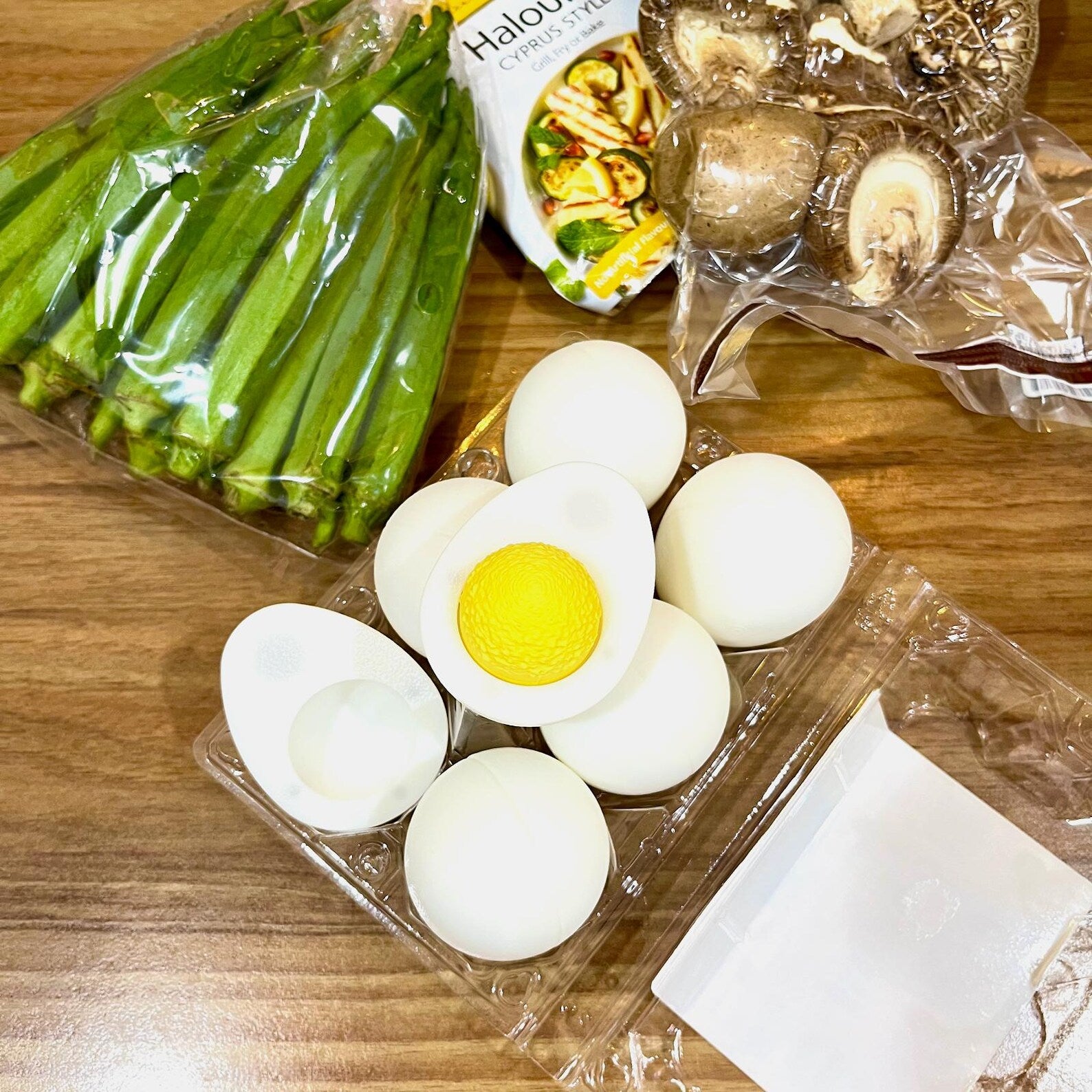 Hard-boiled egg fidget sliced to show yellow yolk clicker