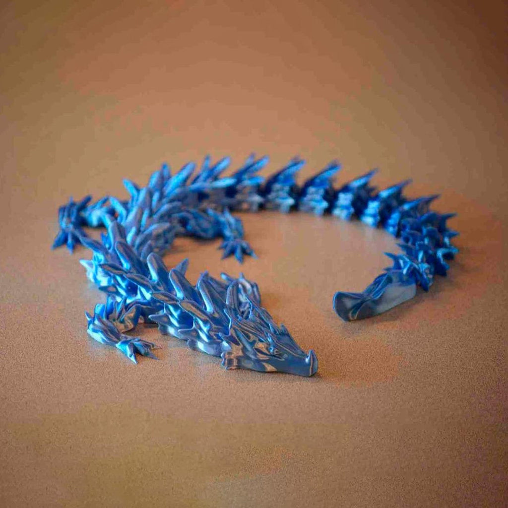 Articulated water dragon 3D printed flexi fidget in metallic blue