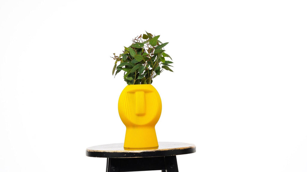 Chubby Dude Figurine yellow planter style with plant