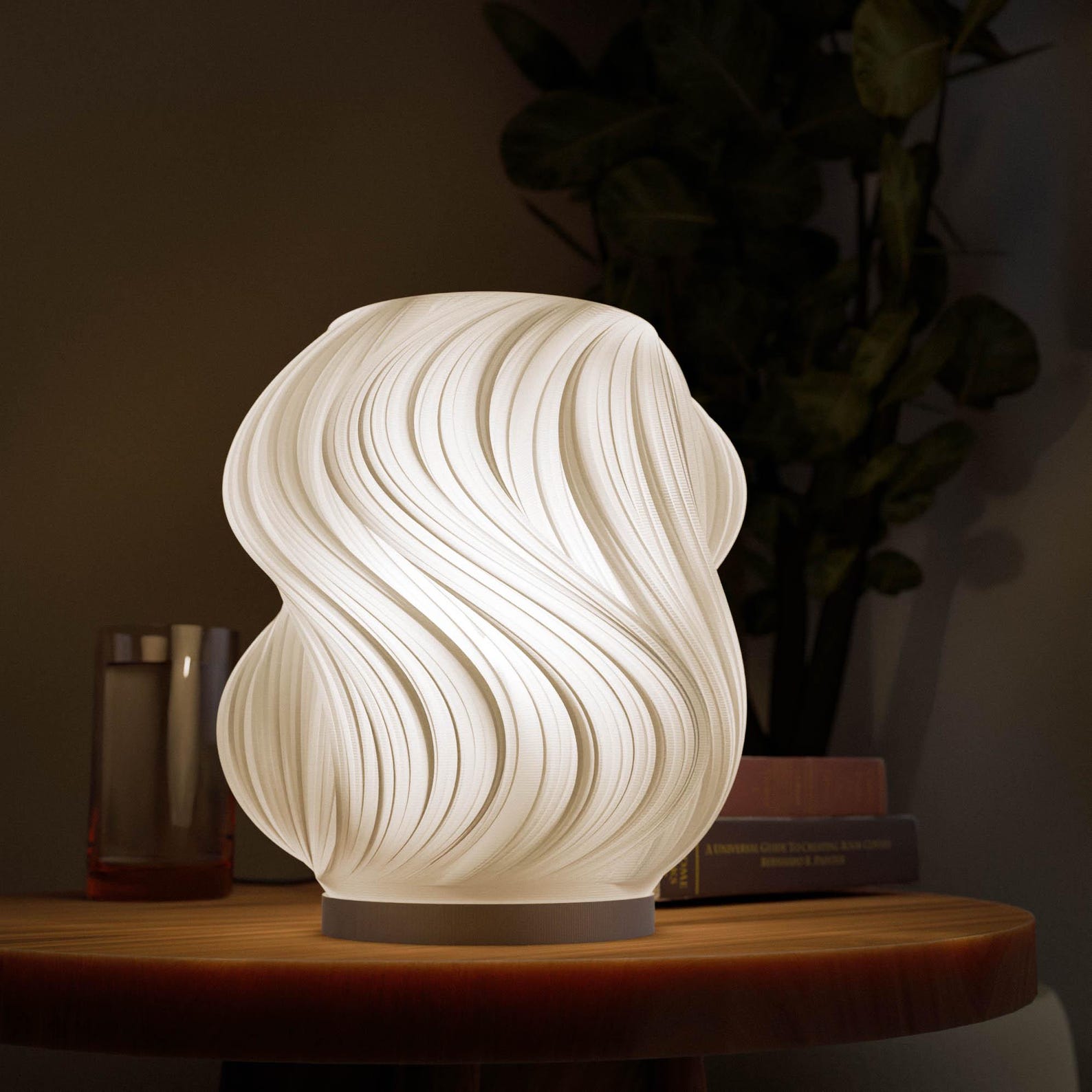Wave table lamp glowing softly with warm diffused light