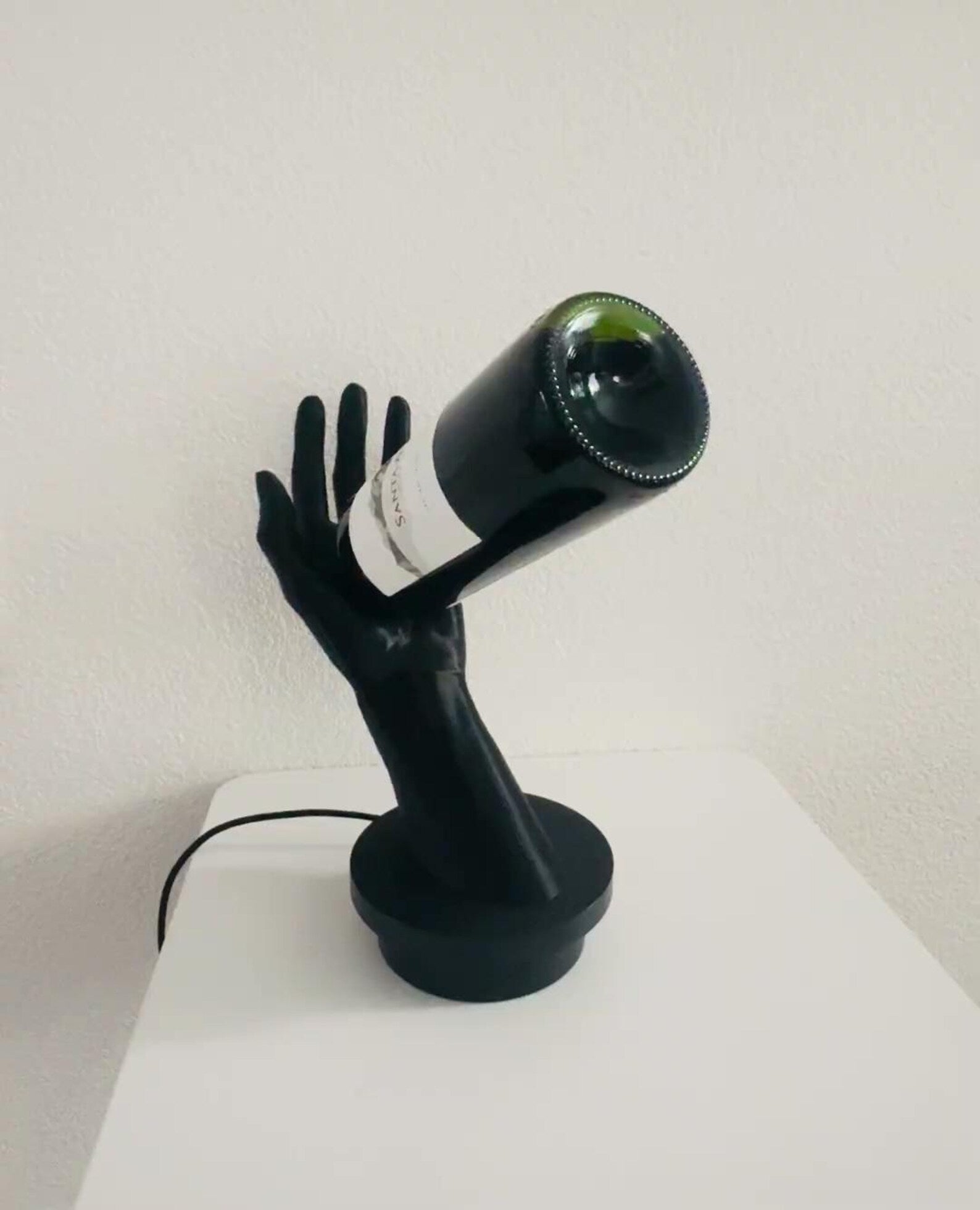 Hand wine bottle holder — holding a bottle