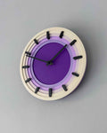 Topo 3D printed topographic contour wall clock on a modern wall