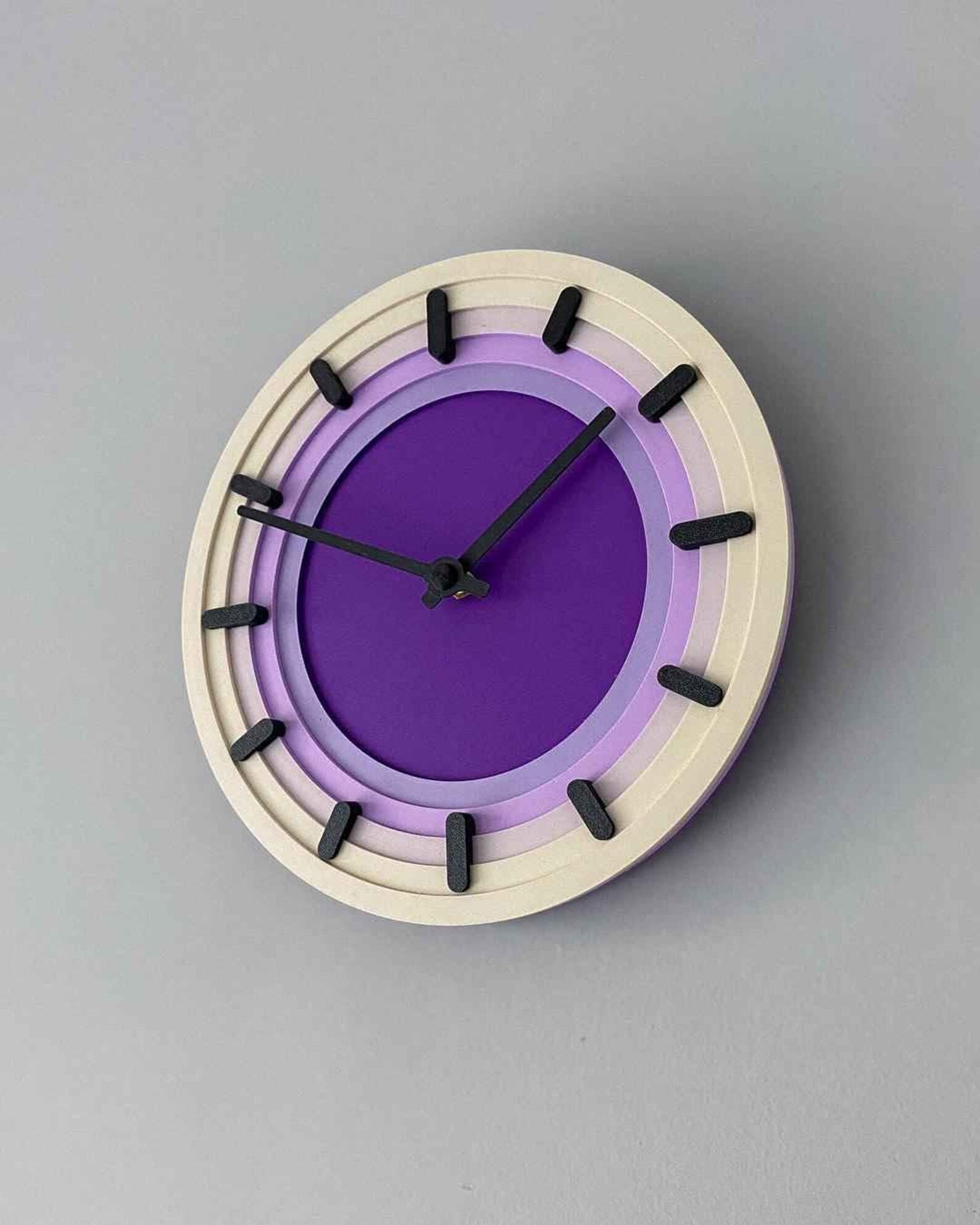 Topo 3D printed topographic contour wall clock on a modern wall