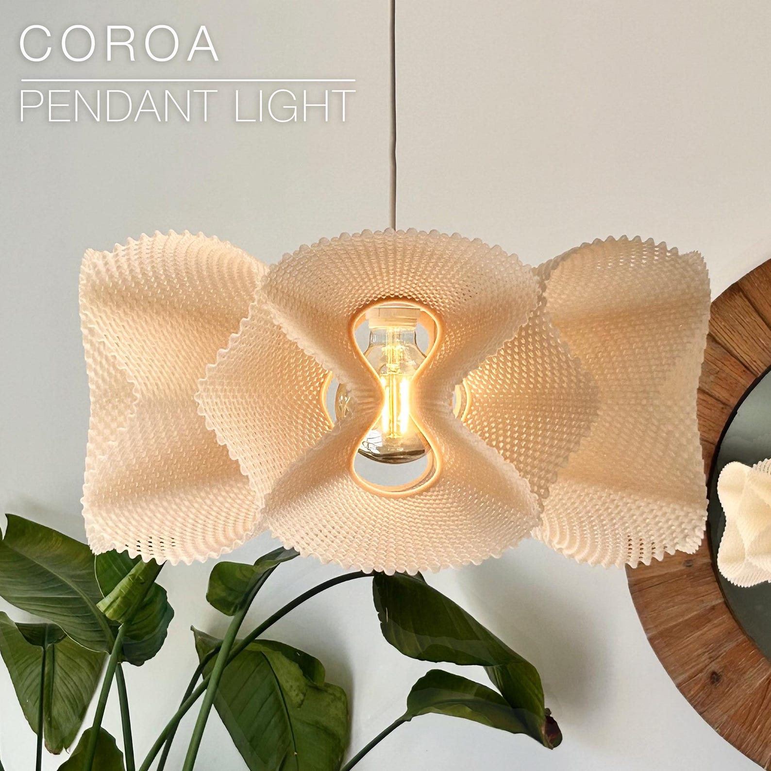 Pleated 3D printed pendant shade glowing over a kitchen island