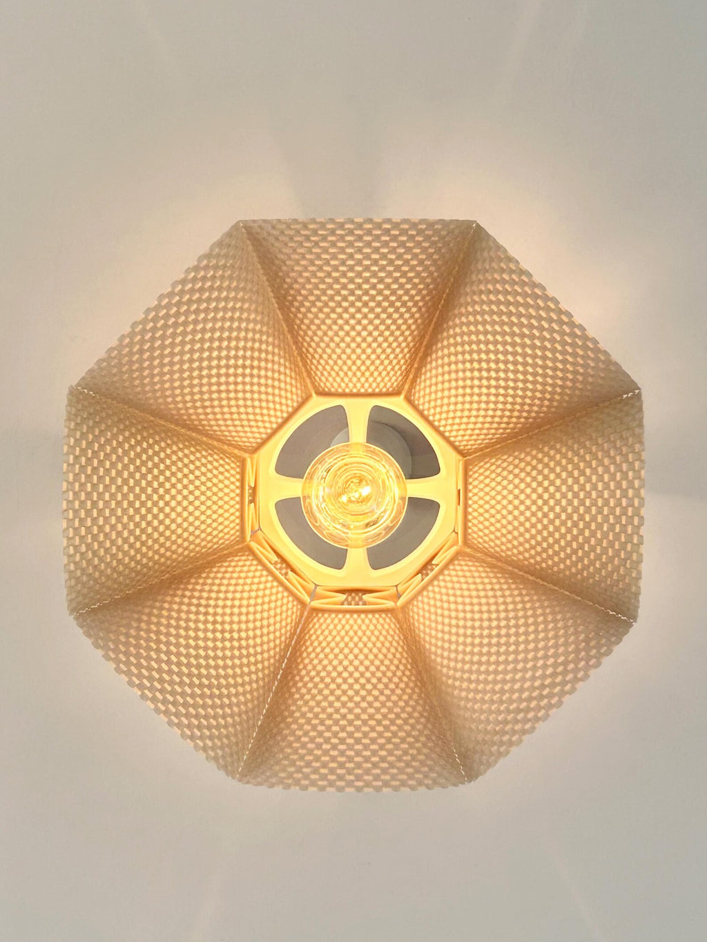 Pleated pendant shade close-up showing texture