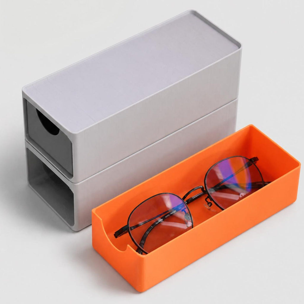 Stackable 3D printed eyewear drawer organizer holding sunglasses