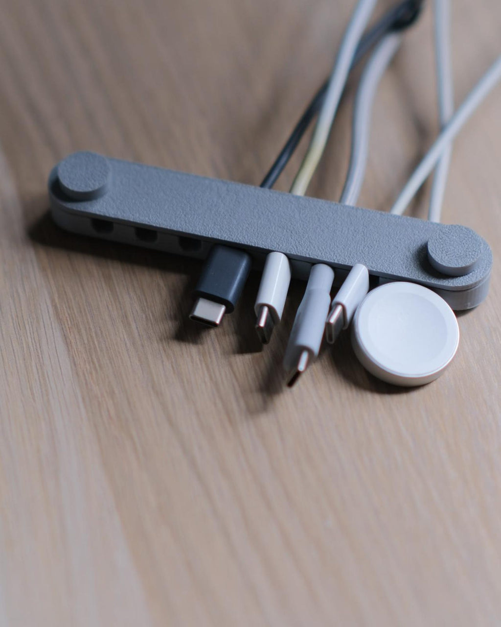 Orbit 8 cable organizer — watch dock in use