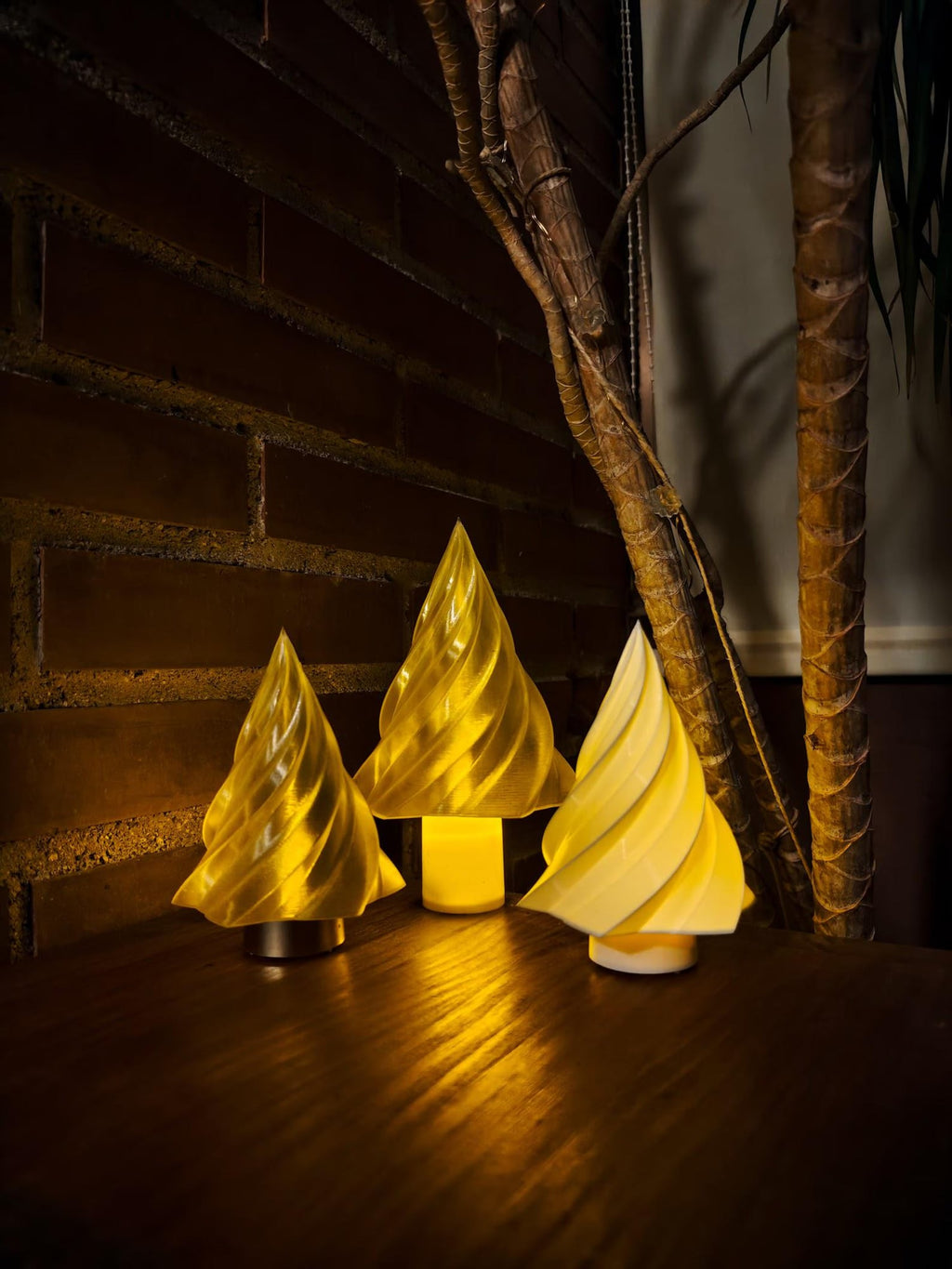 Kiki geometric 3D printed Christmas tree lamp glowing on a mantel