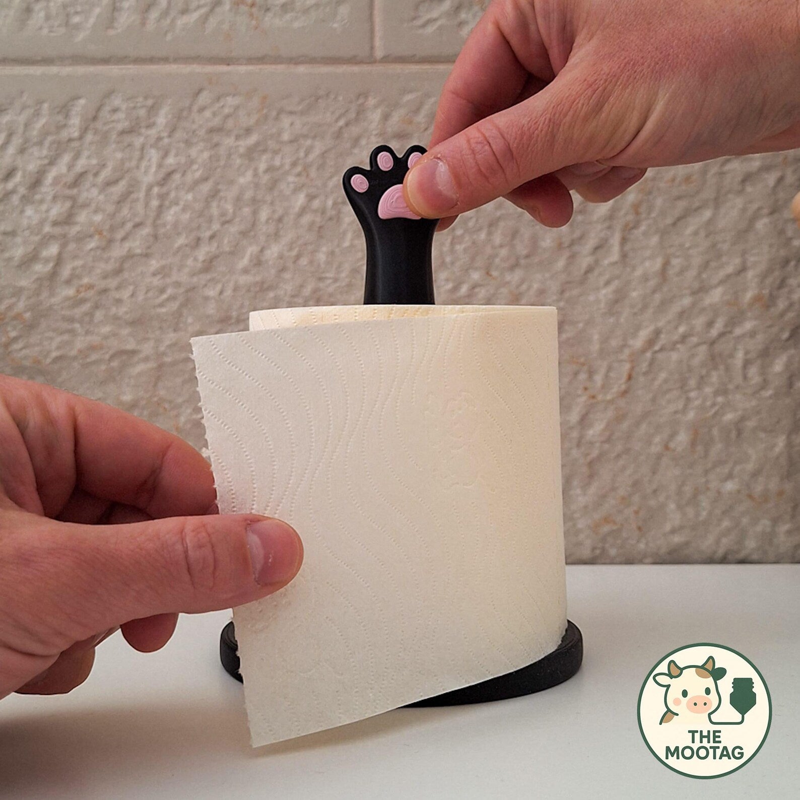 Cat paw paper holder in use