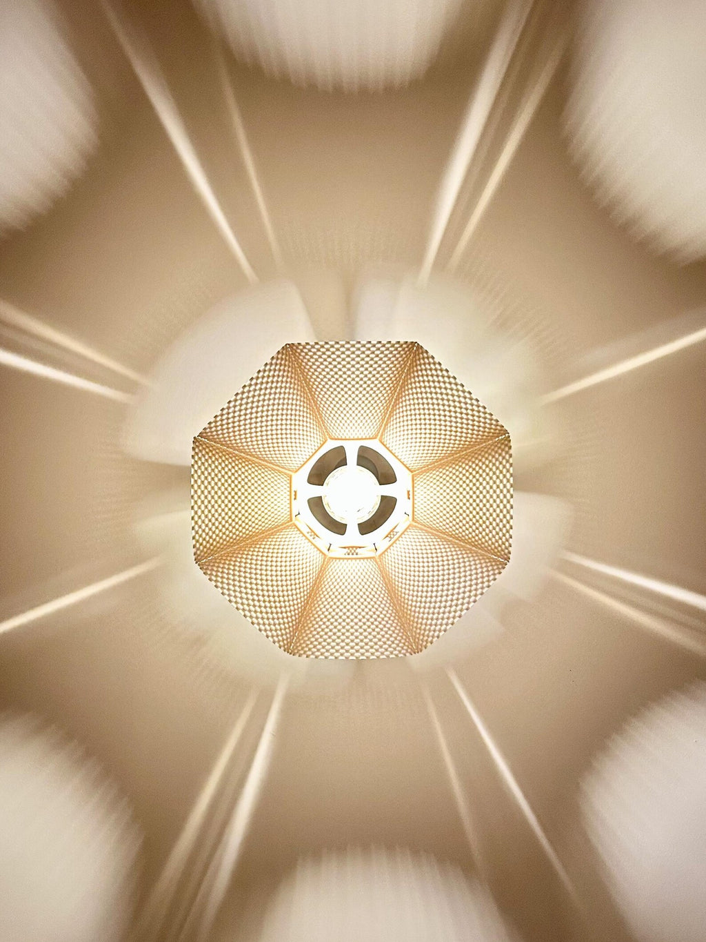 Modern pleated pendant light in a dining room