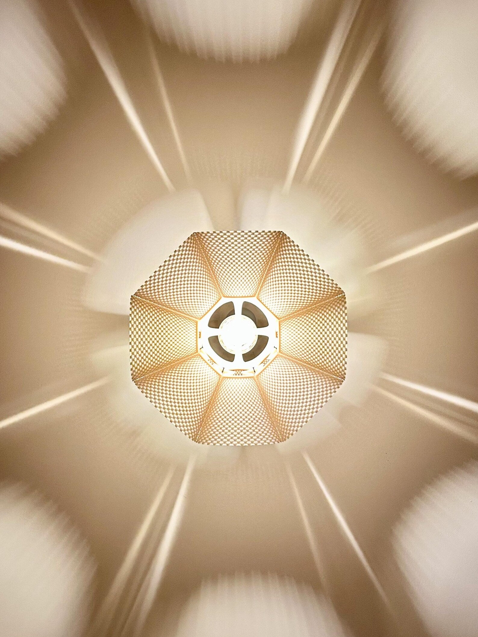 Modern pleated pendant light in a dining room