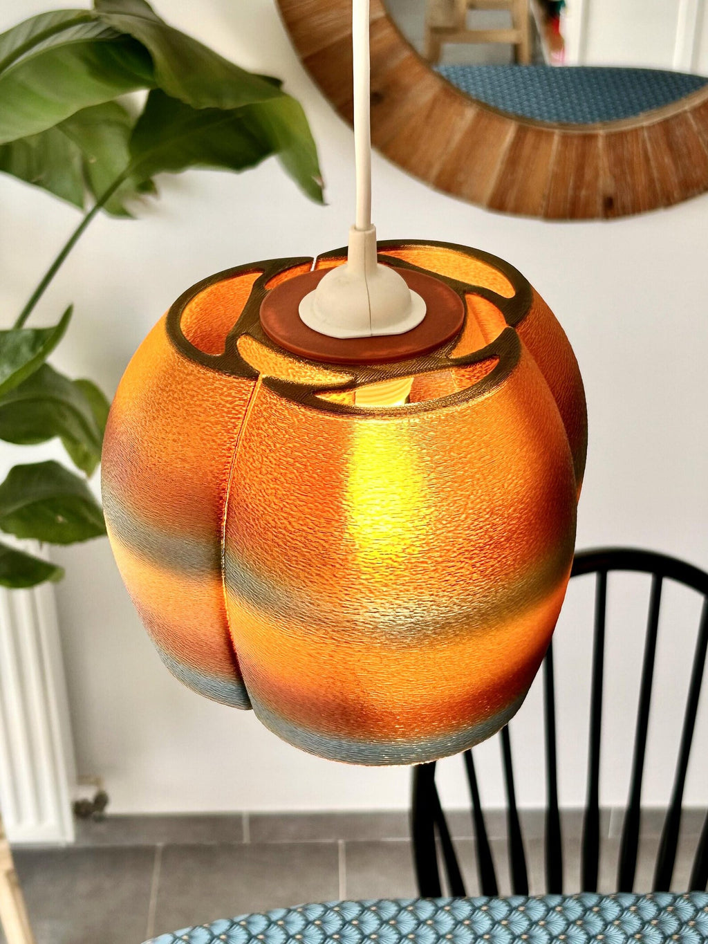 Sakura pendant glowing over a dining table